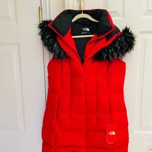 North face red brand new quilted vest and is just above the knee!